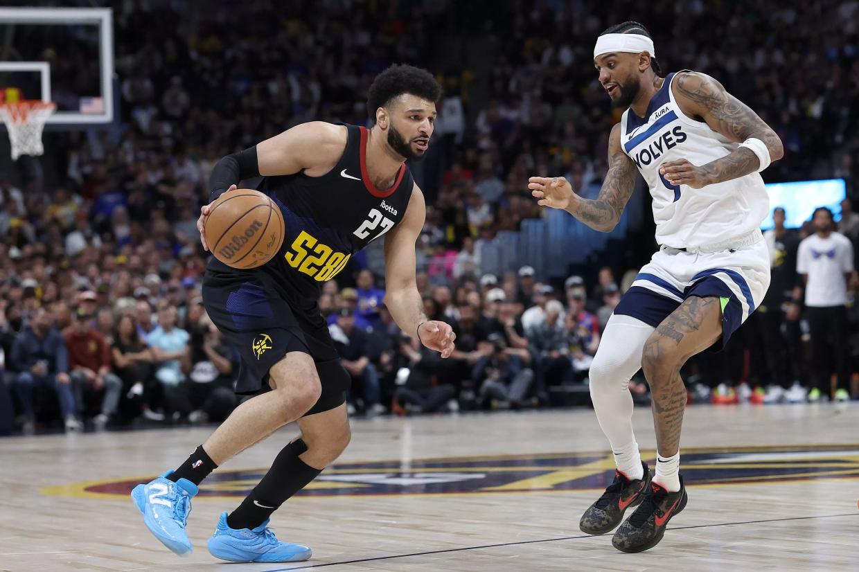 Jamal Murray is guarded by Nickeil Alexander-Walker