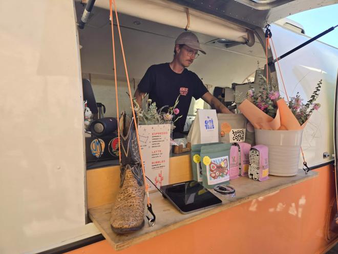a man standing behind a counter