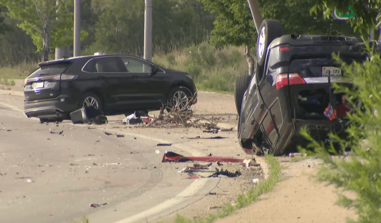 Cars smashed up on a road after an accident.
