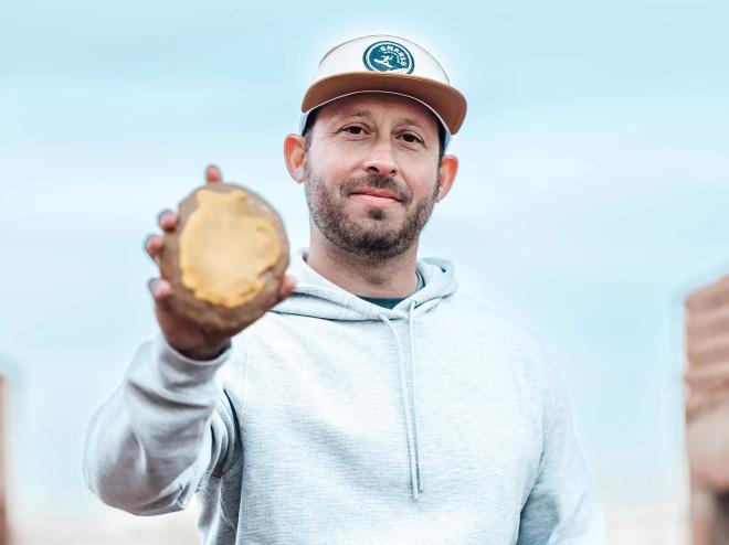 man holding a cookie