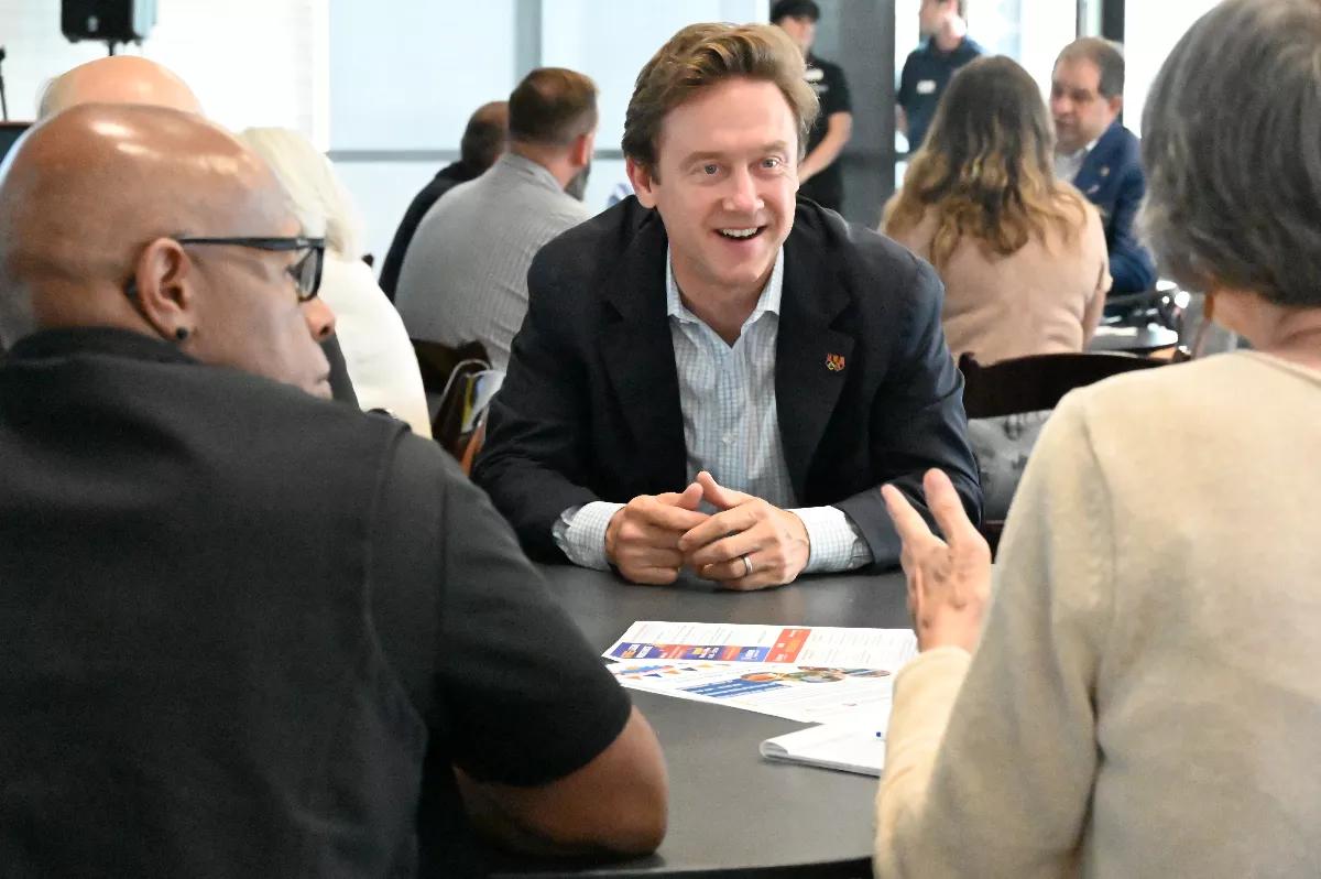 A man smiles.