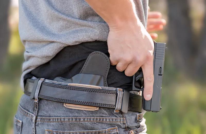 Man pulls handgun from concealed carry holster
