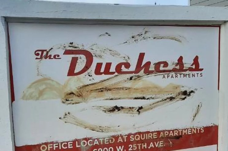 Feces is smeared on a sign.