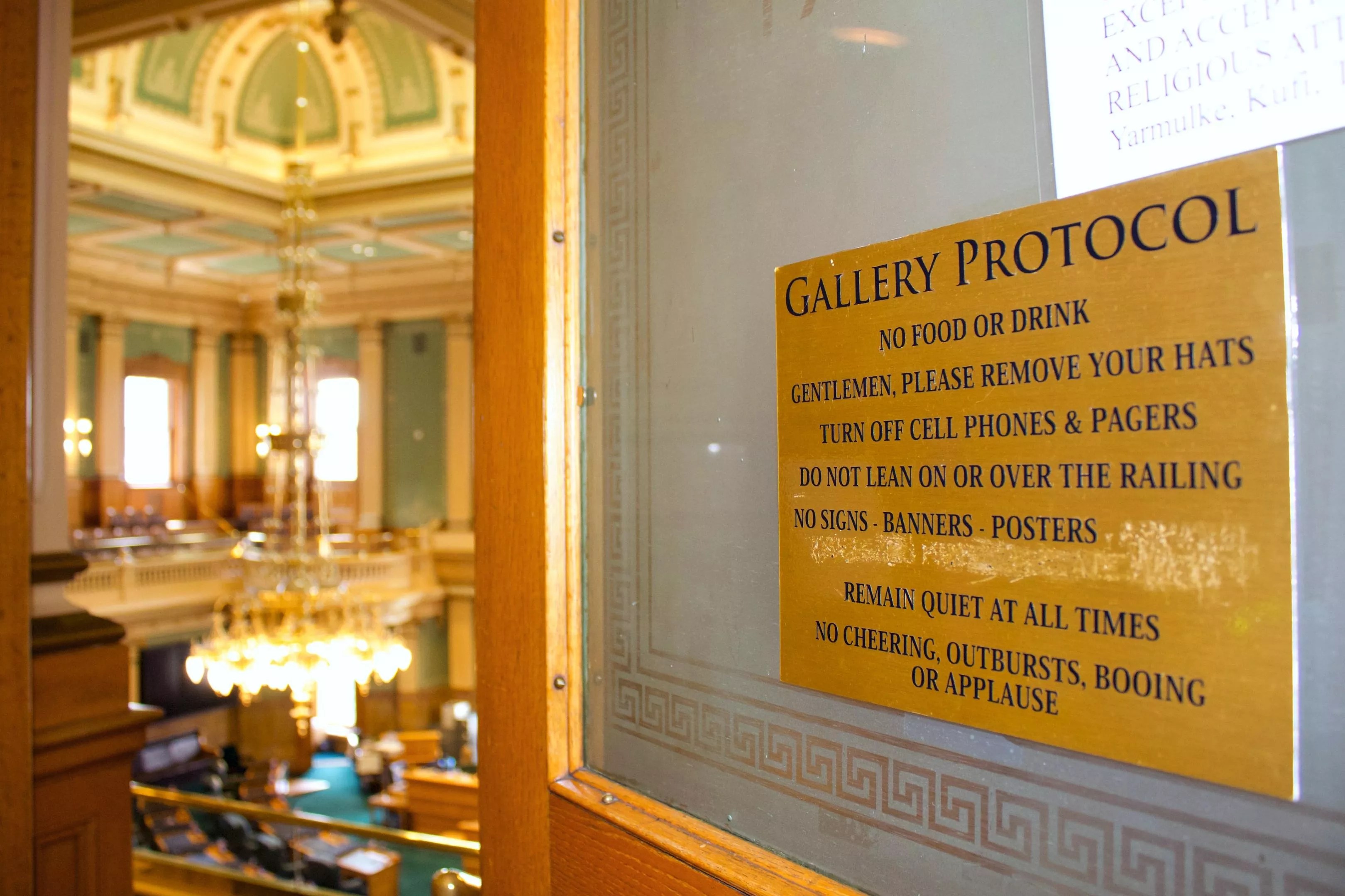 Protocol rules plaque with words scratched off