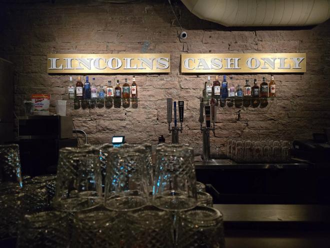 glasses in front of a bar