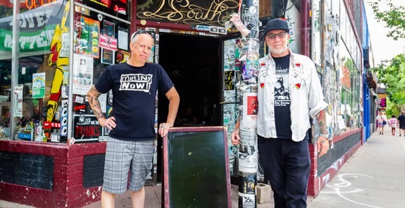 two men outside store
