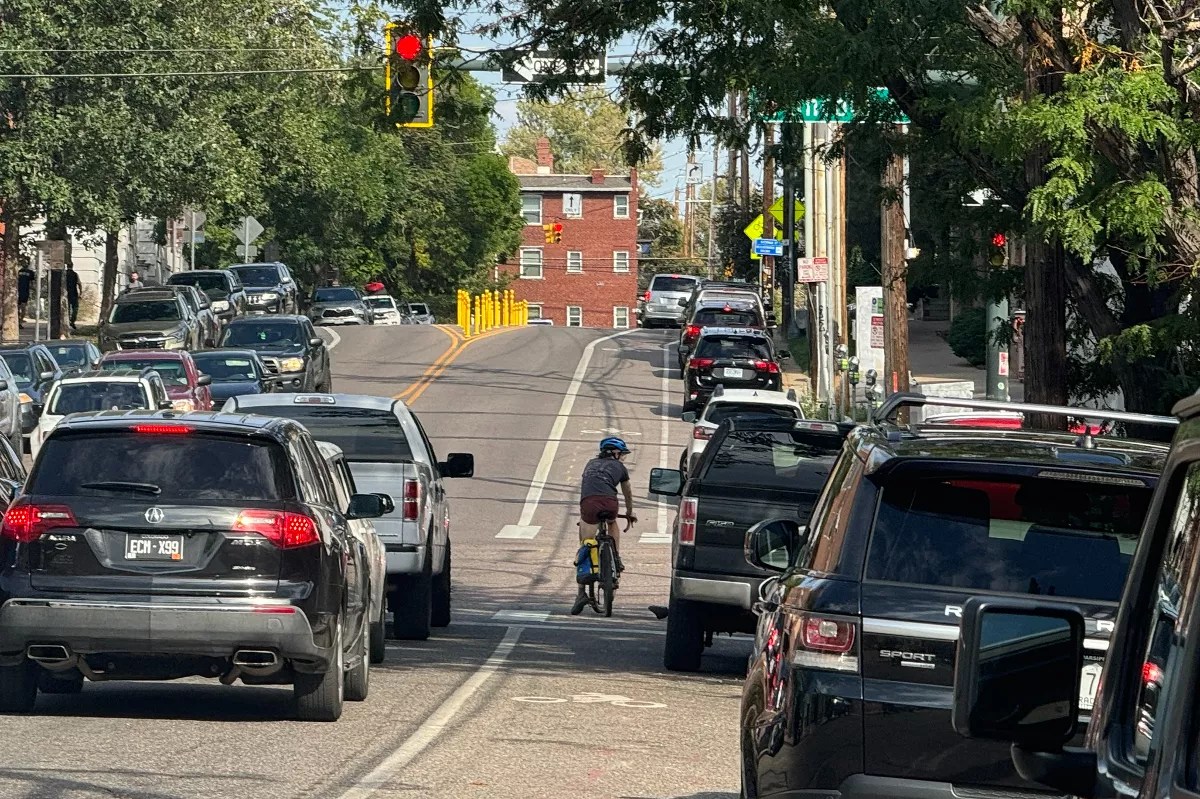 A cyclist goes down 11th Avenue.