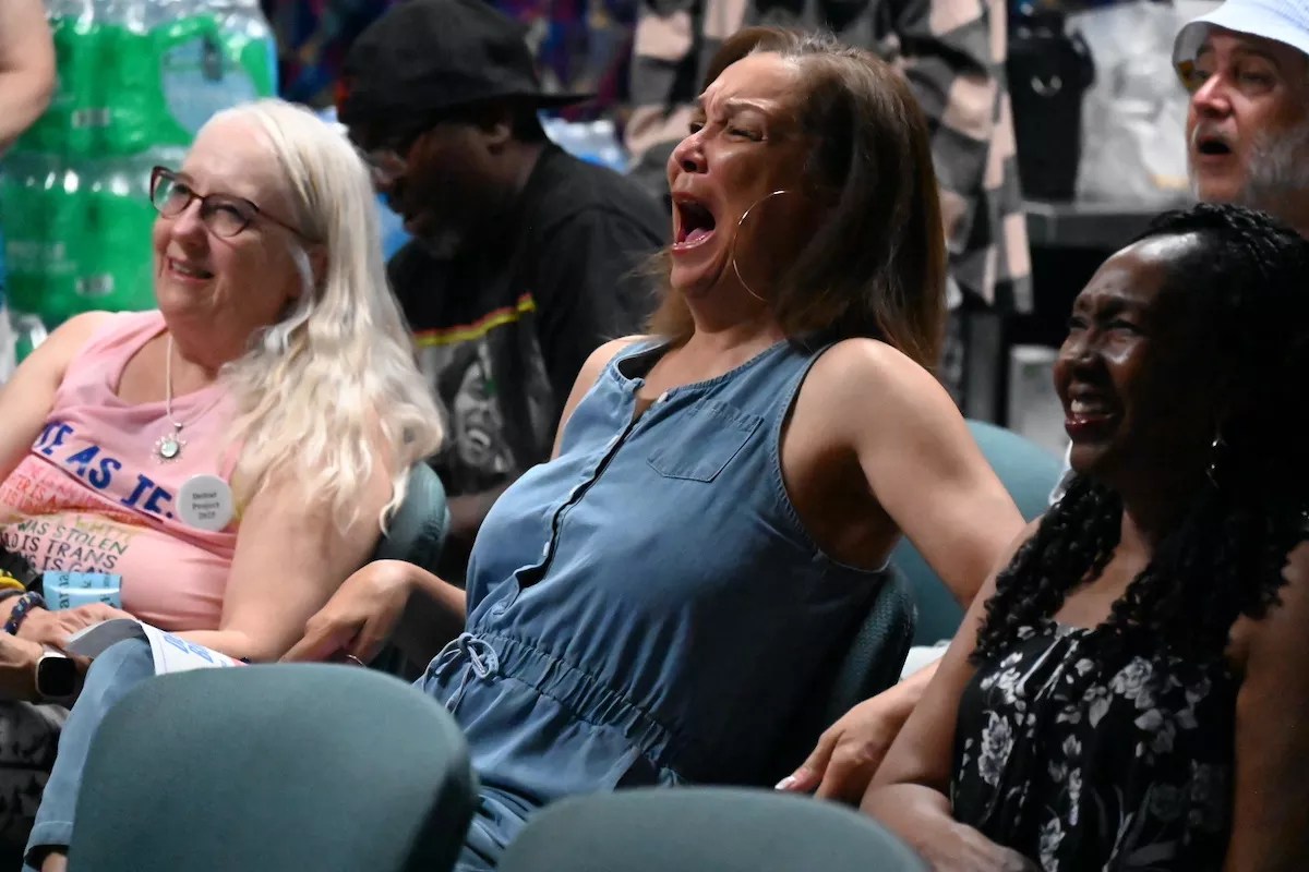 A woman laughs.