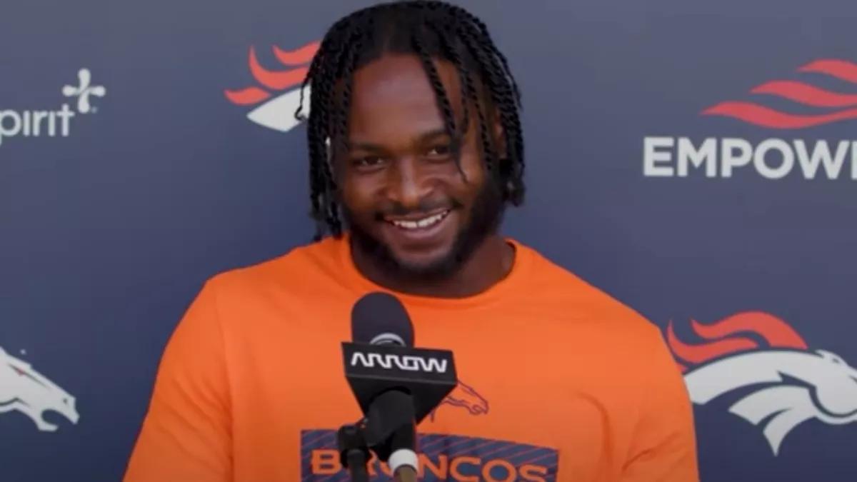 NFL player Javonte Williams during post-game press conference