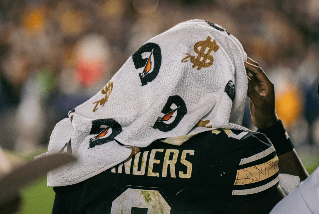 Football player with towel on head