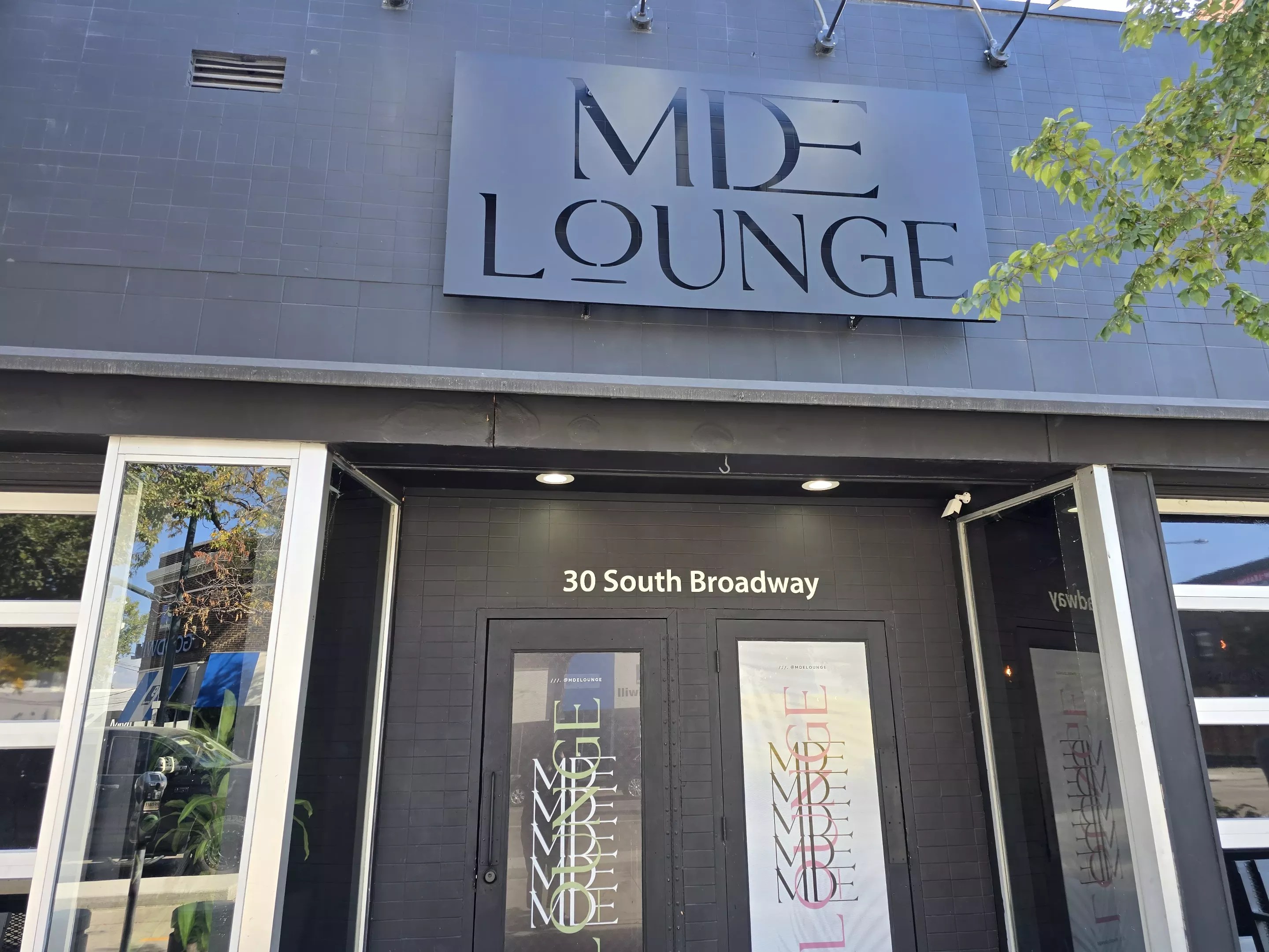 "mde lounge" sign over a door