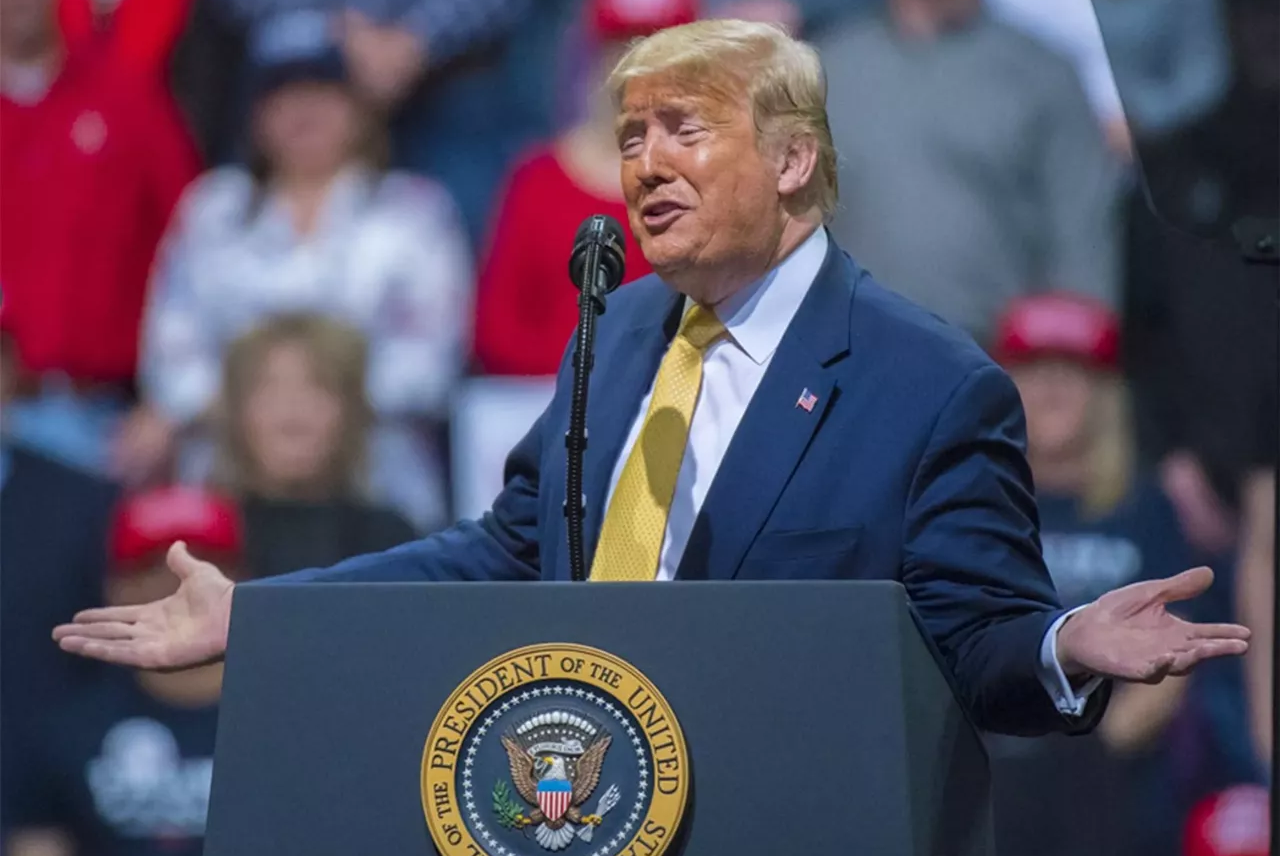 donald trump at podium during rally