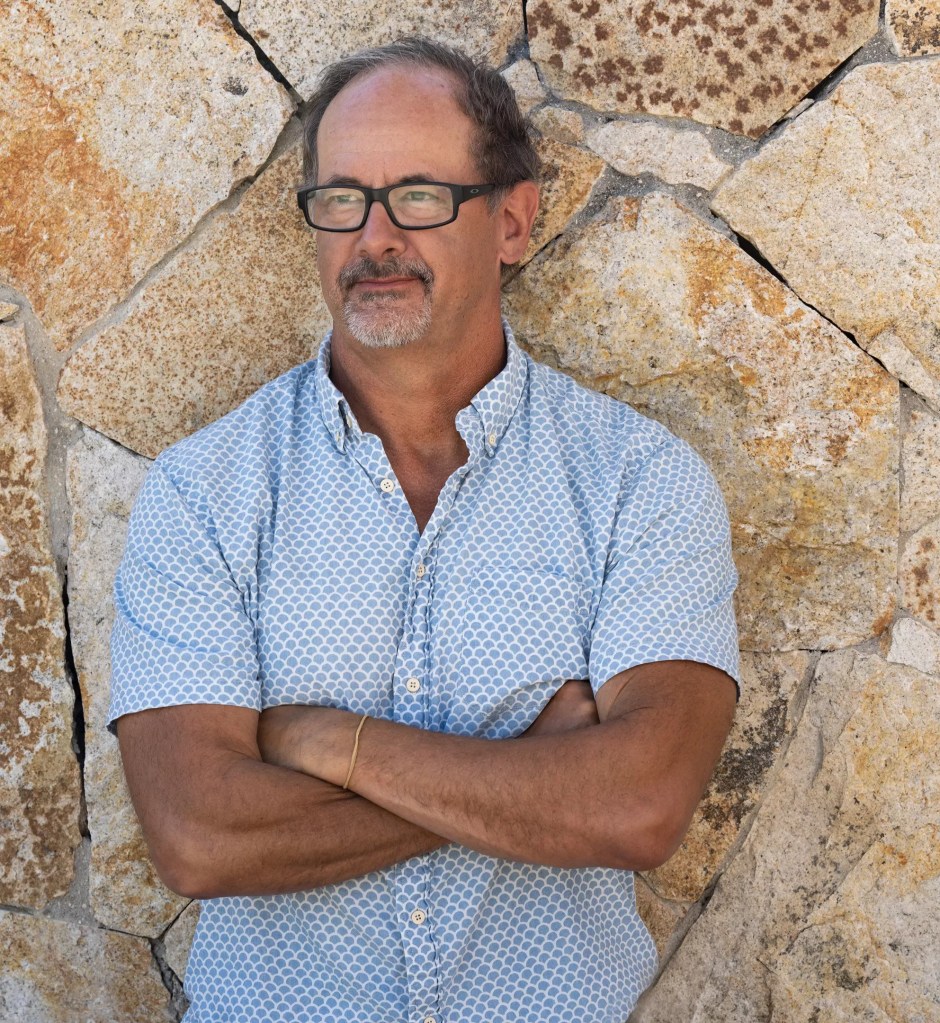 man with arms folded