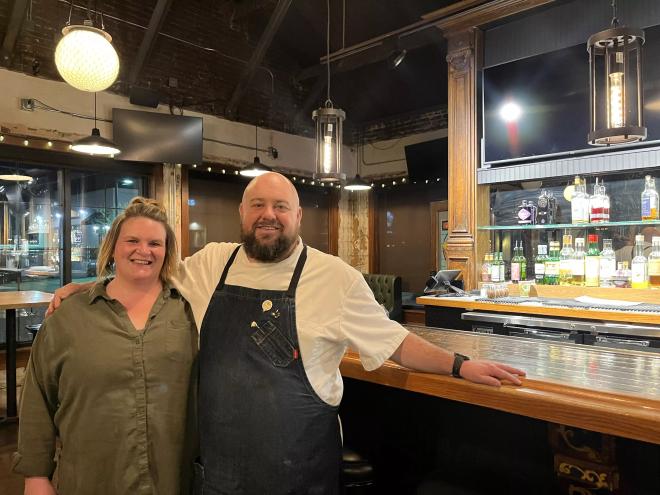 woman and man in a apron posing