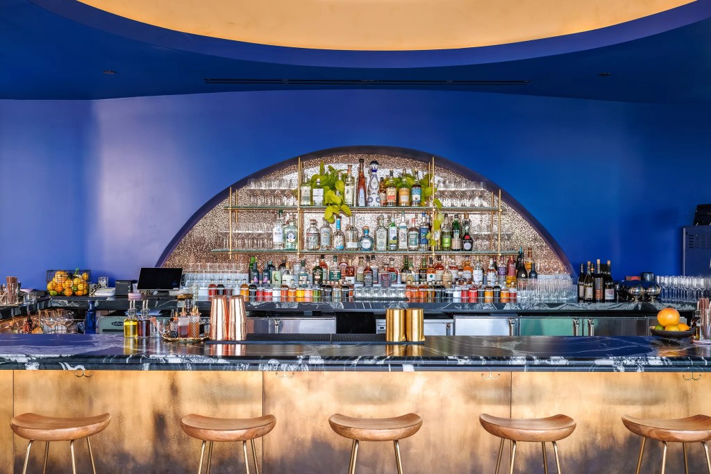 stools in front of a stocked bar