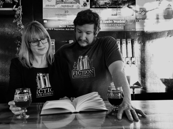 Two brewery owners behind the bar.
