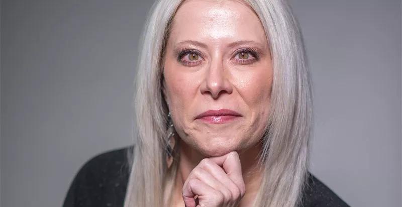 blonde woman looking at camera