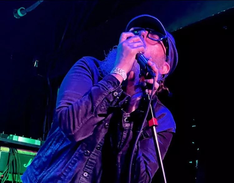 Luke Fairchild singing into a microphone