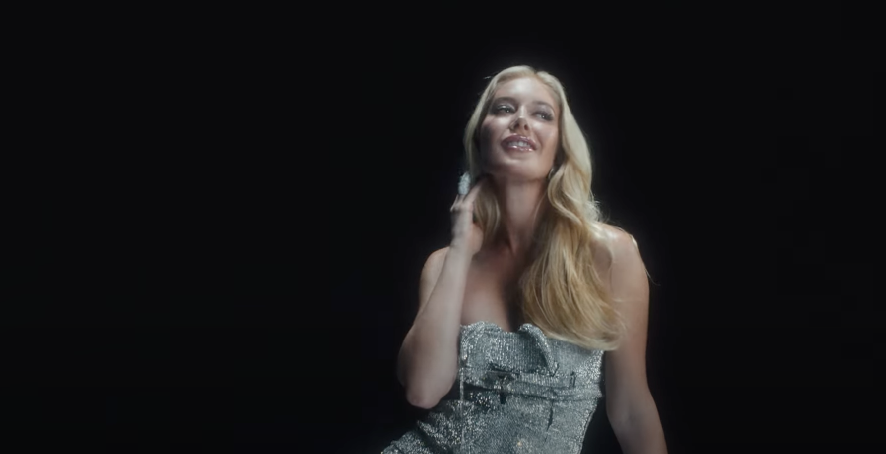 Heidi Montag posing in a silver dress