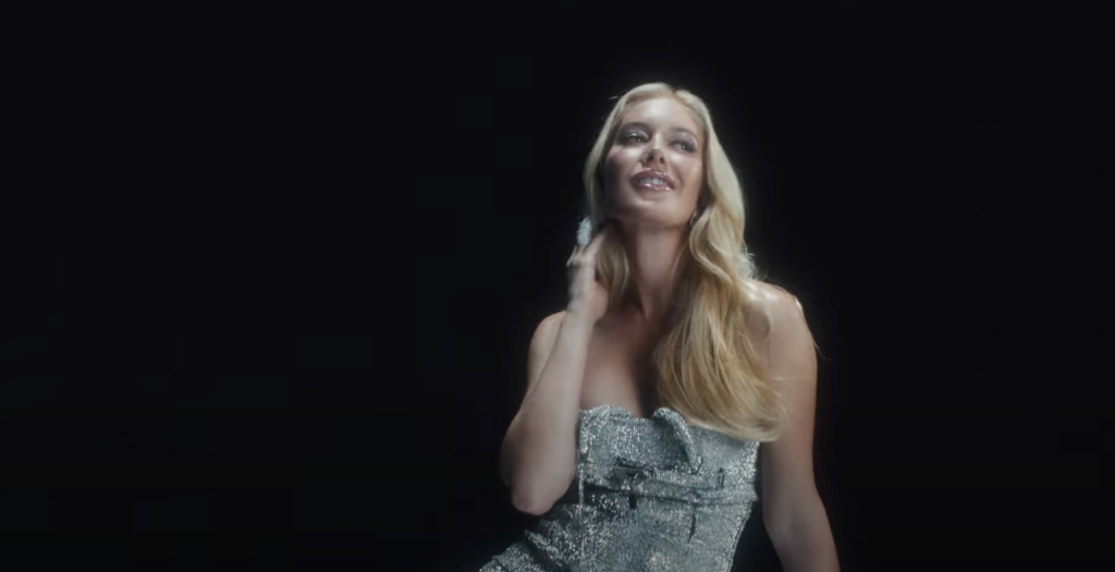 Heidi Montag posing in a silver dress