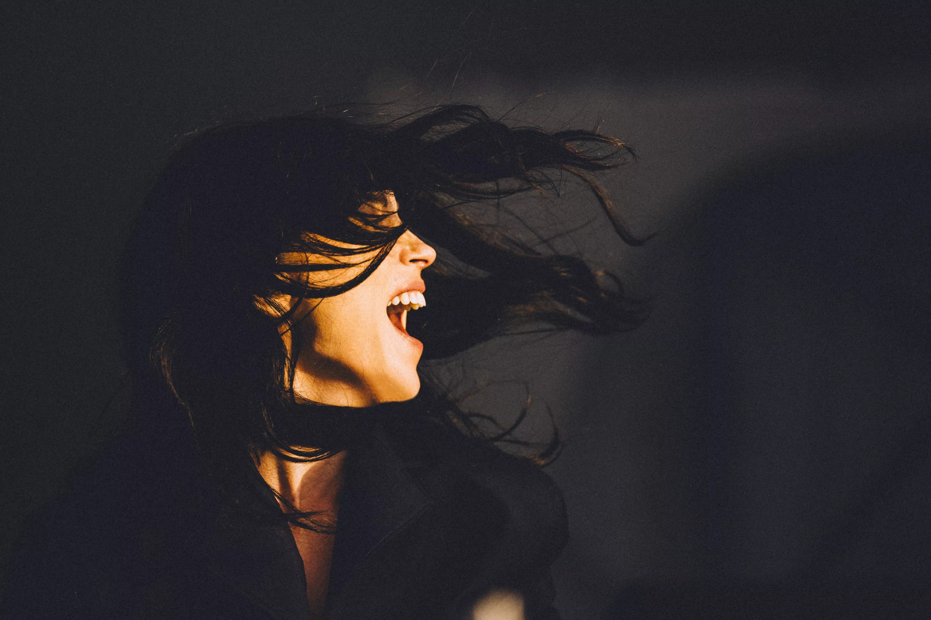 singer St. Vincent with her hair in her face