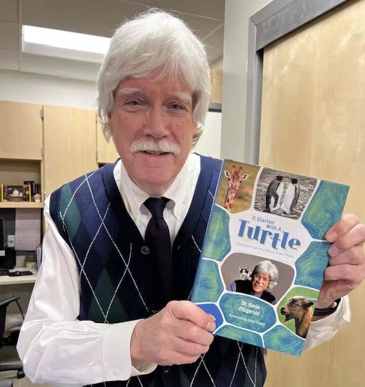 Man holds a book.
