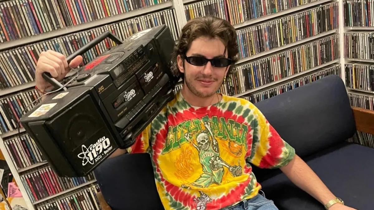 man in tie-dyed shirt with radio