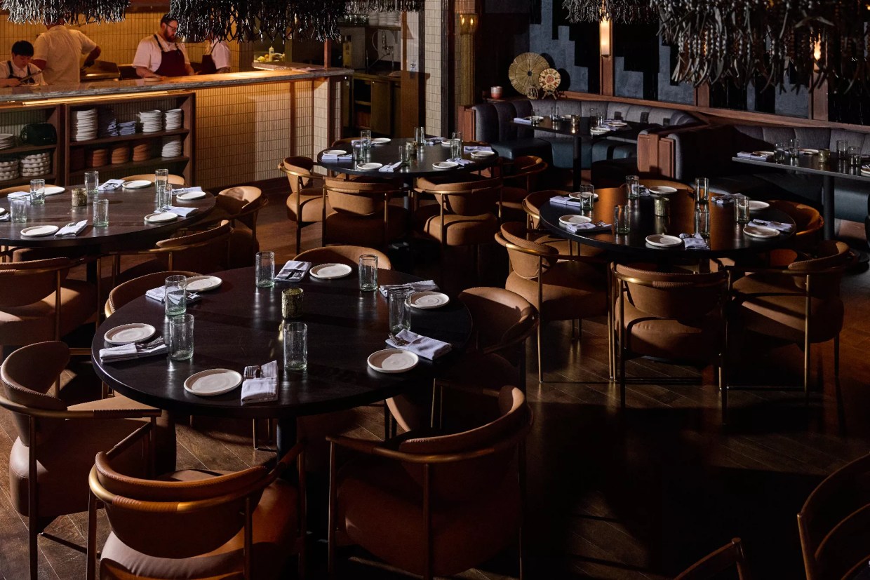 a restaurant dining room with empty tables