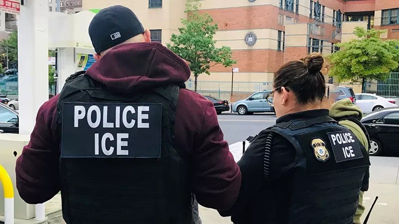 People in ICE uniforms by hospital