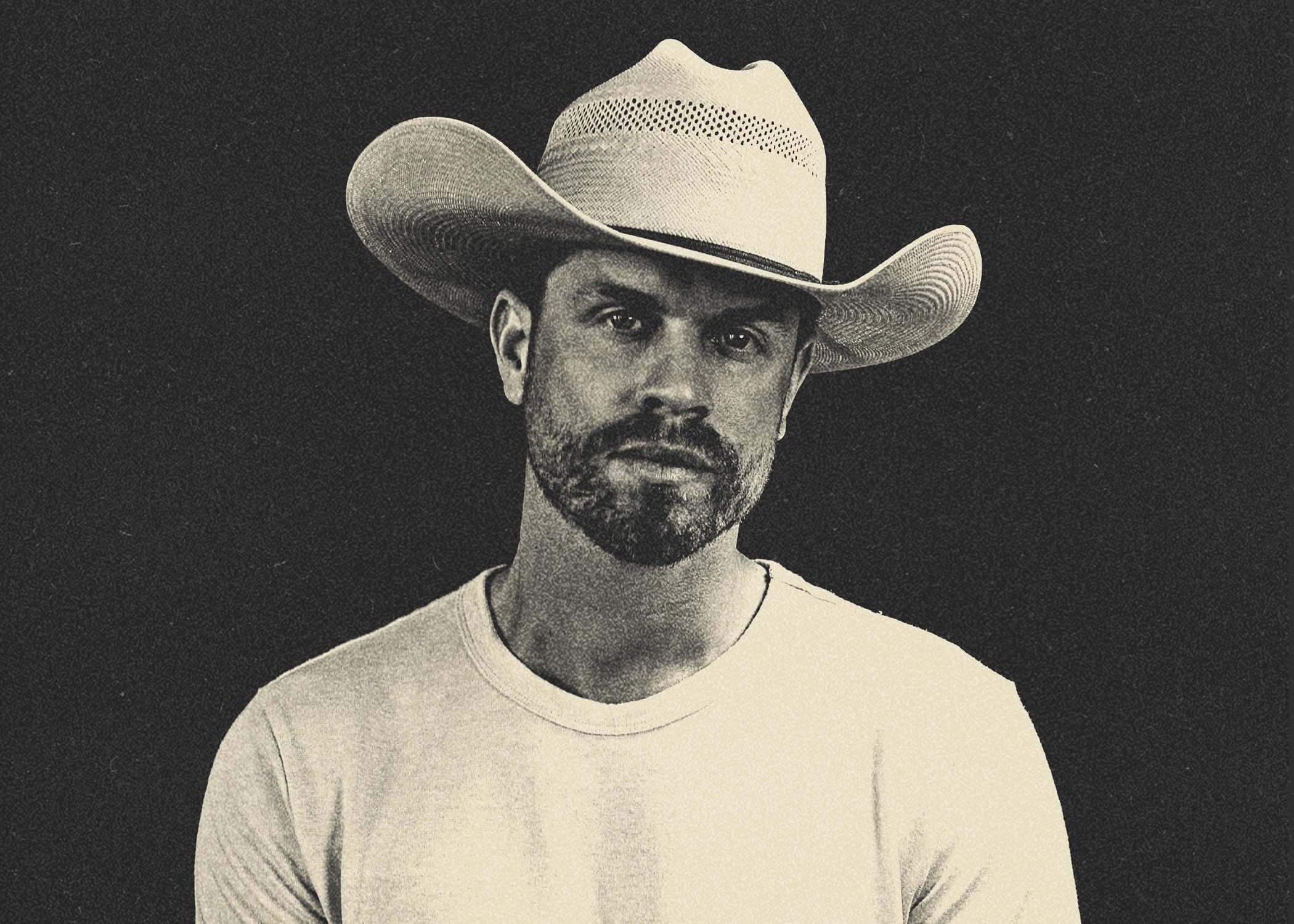 man in a white cowboy hat