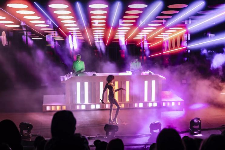 A photo of Polo Pan with performer Victoria Lafaurie on stage.