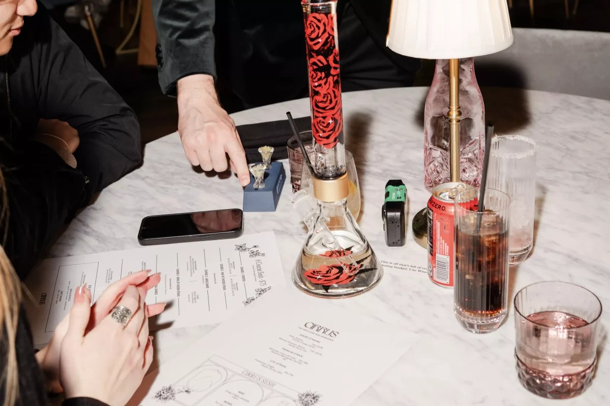 Guests overviewing the cannabis menu at Cirrus Social Club