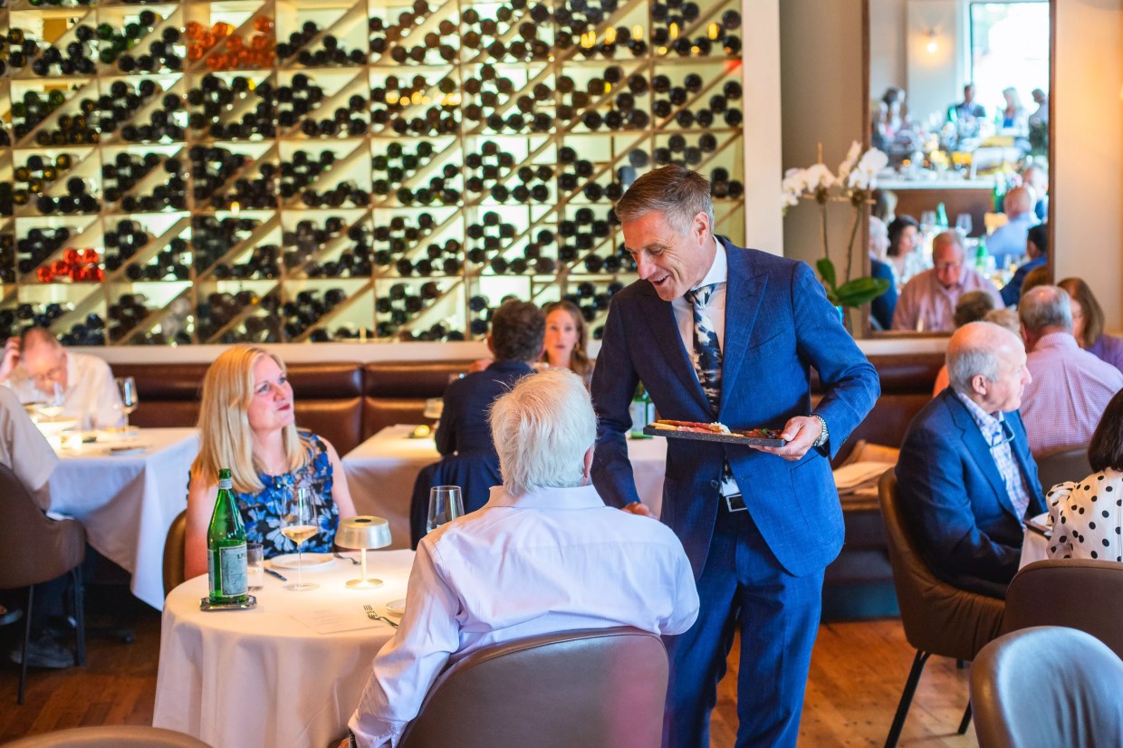 man pouring wine