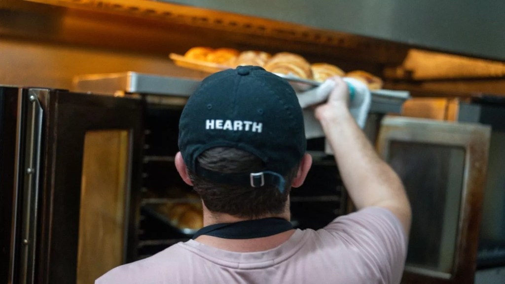 man opening oven at Hearth