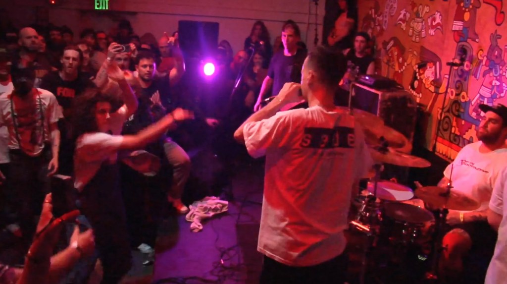 A band performing to a crowded room.