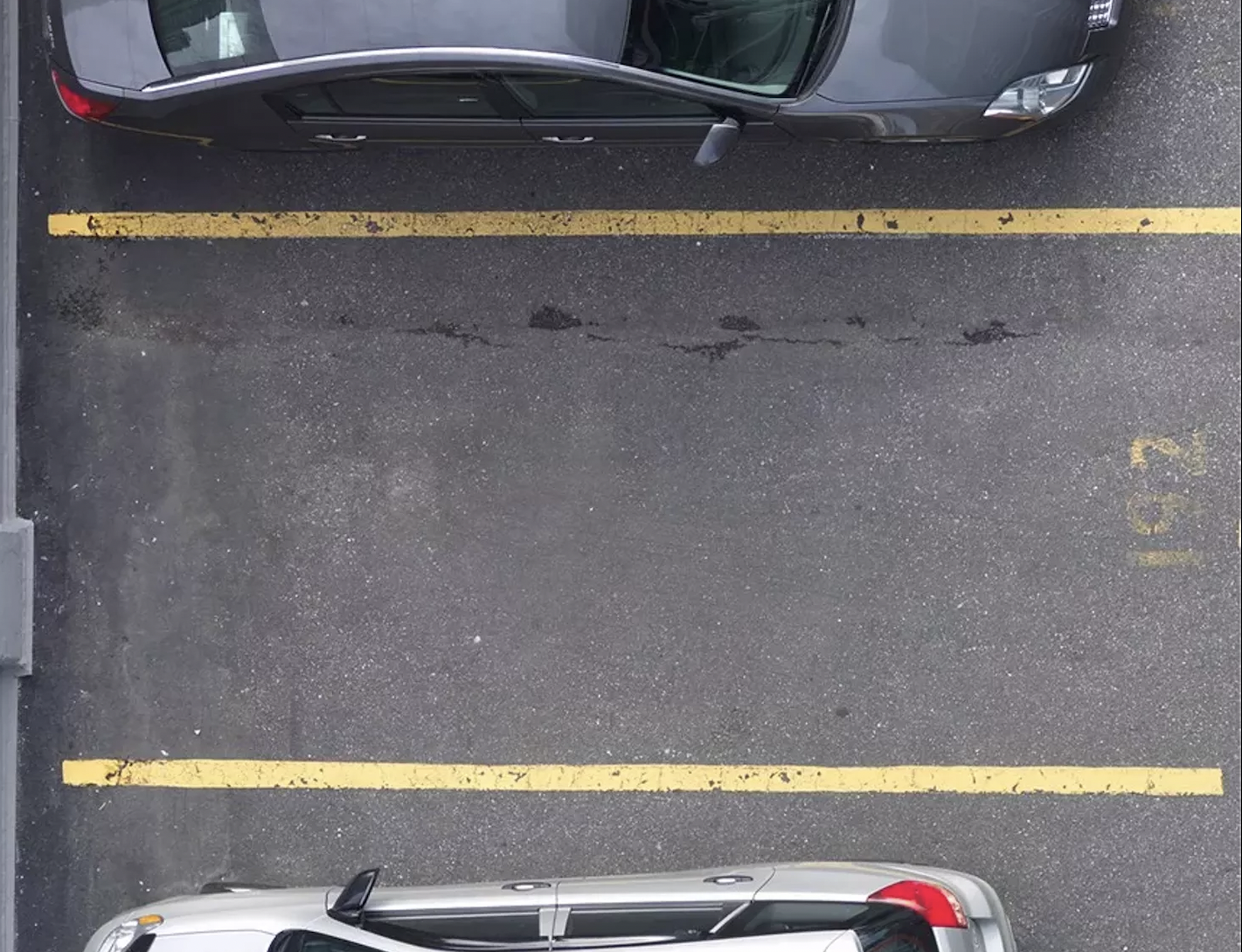empty parking spot between two parked cars