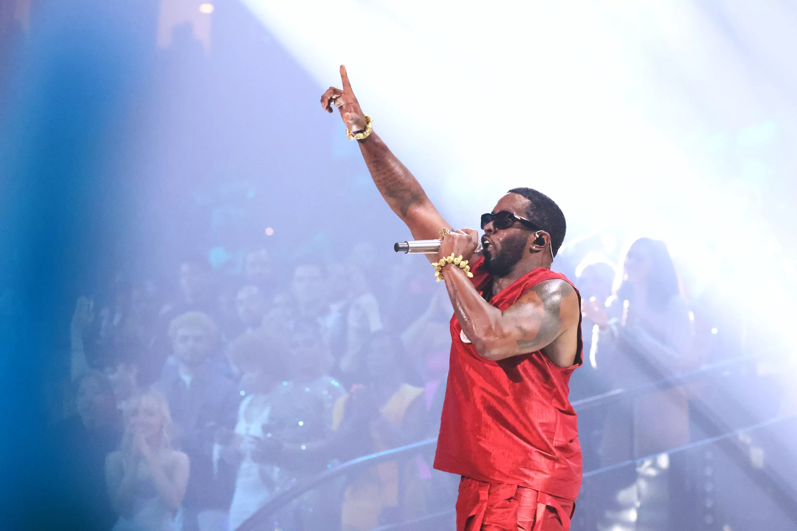 P Diddy performing in a red jersey