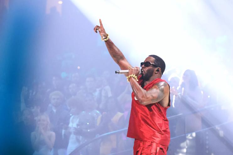 P Diddy performing in a red jersey