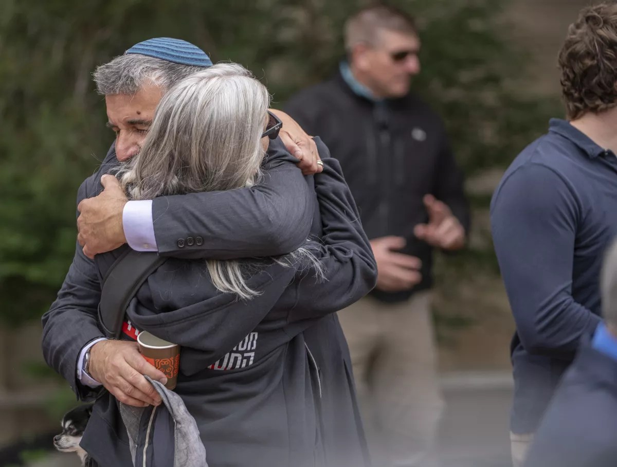 man and woman hug
