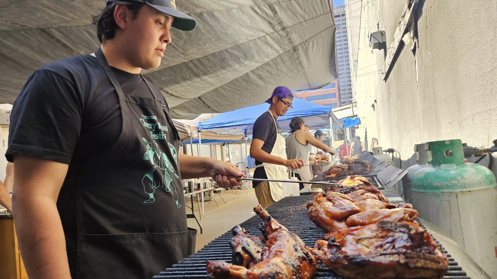 People cooking chicken