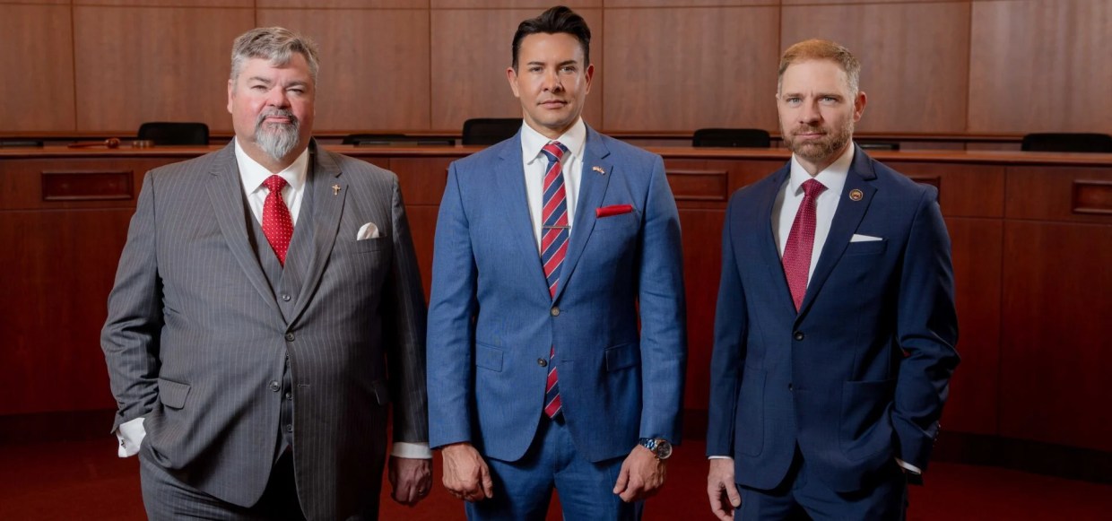 three men in suits.