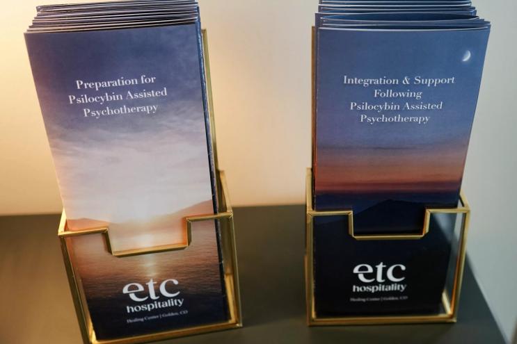 Pamphlets on preparation and integration — the before and after of psychedelic therapy — on display at Etc Hospitality