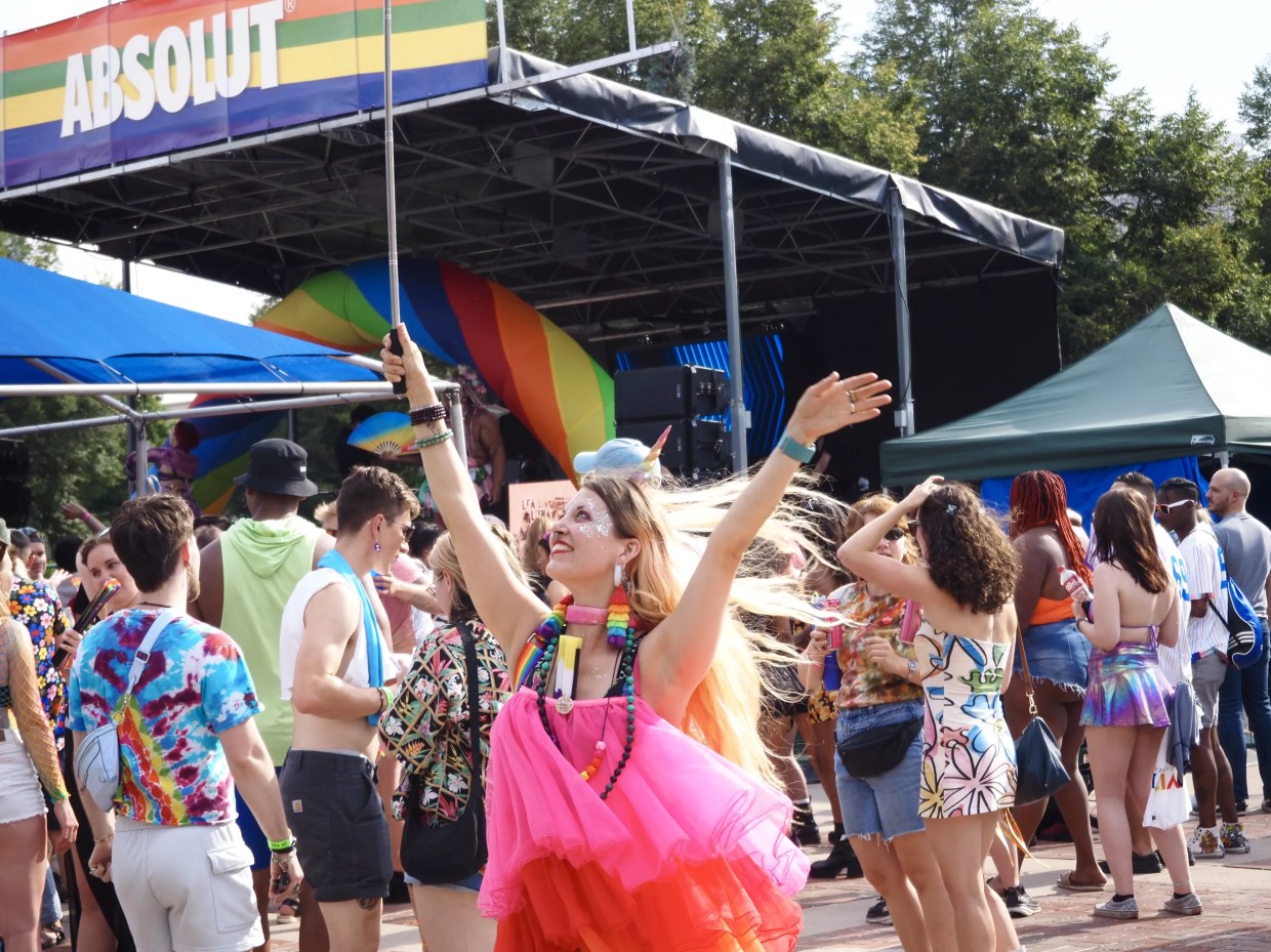 A person in a pink dress dances