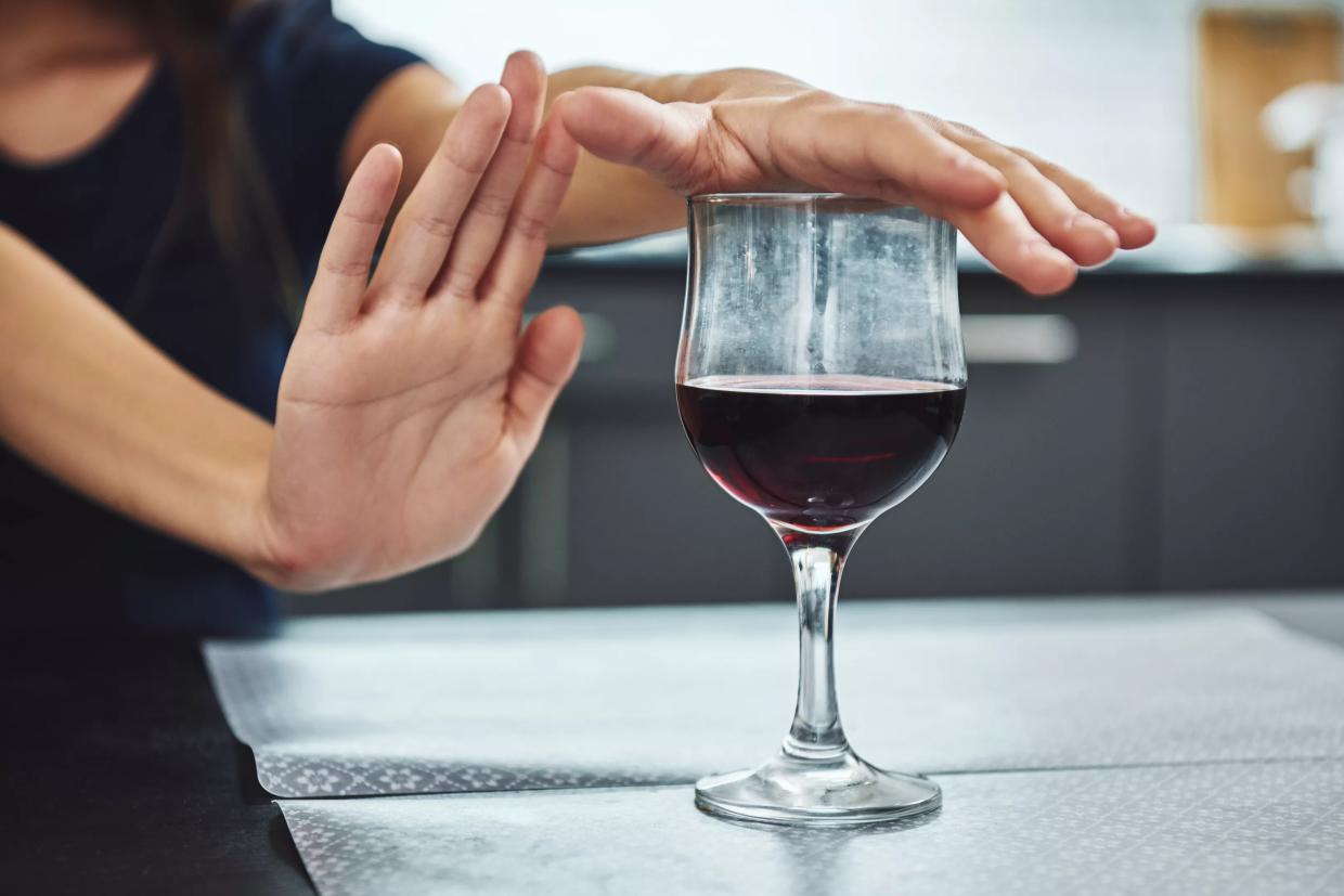 woman refusing wine