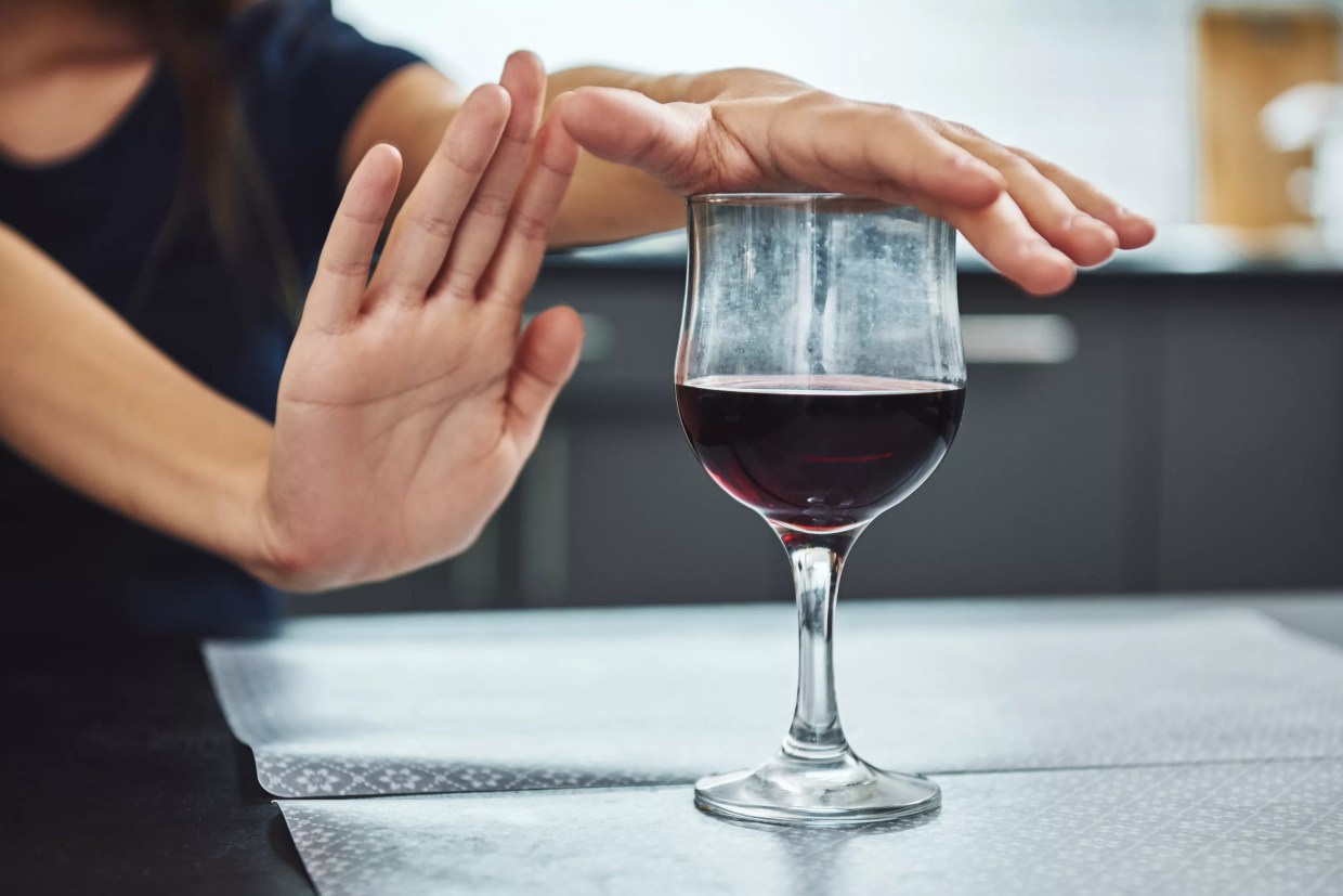 woman refusing wine