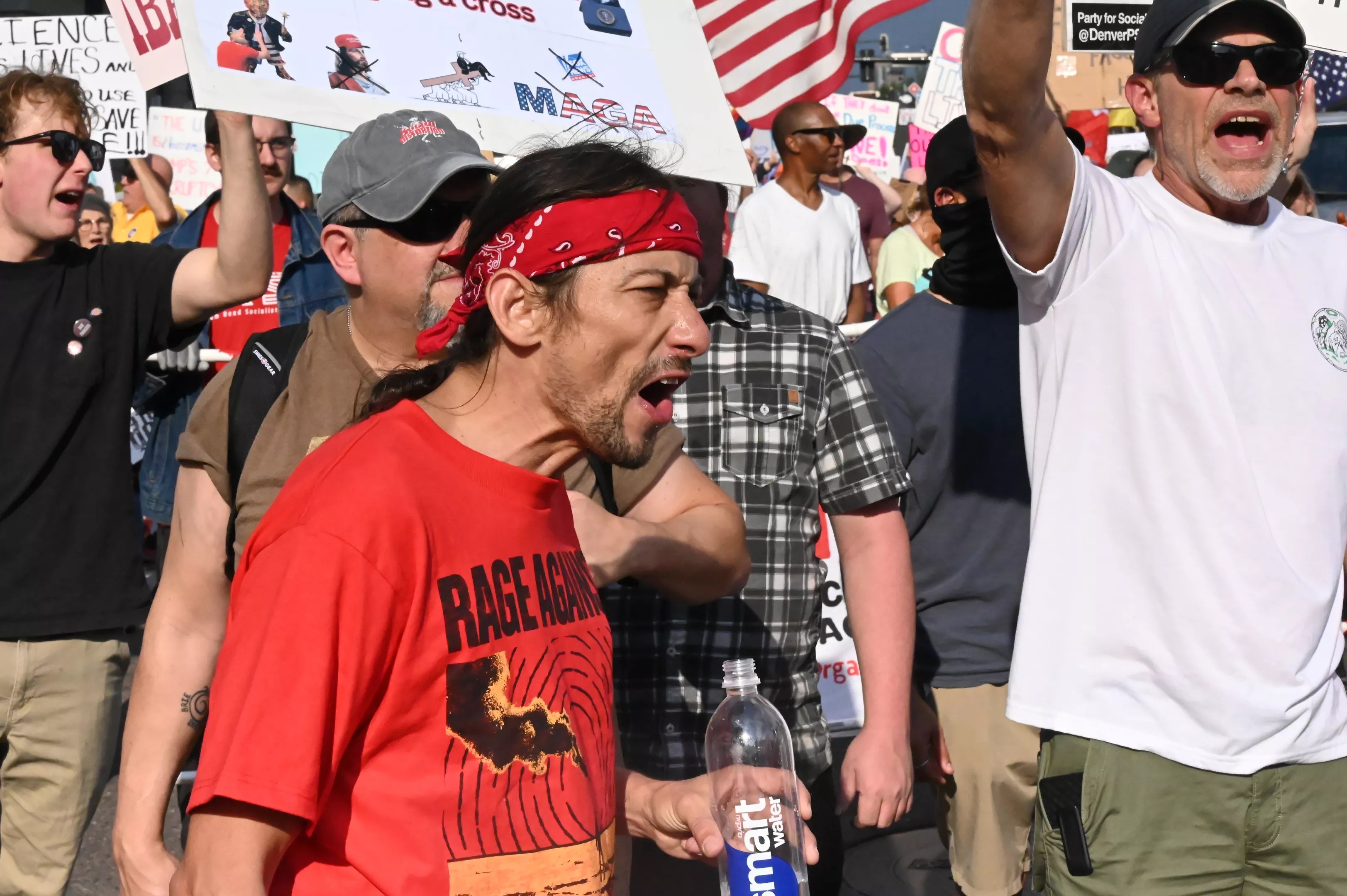 A protester yells.