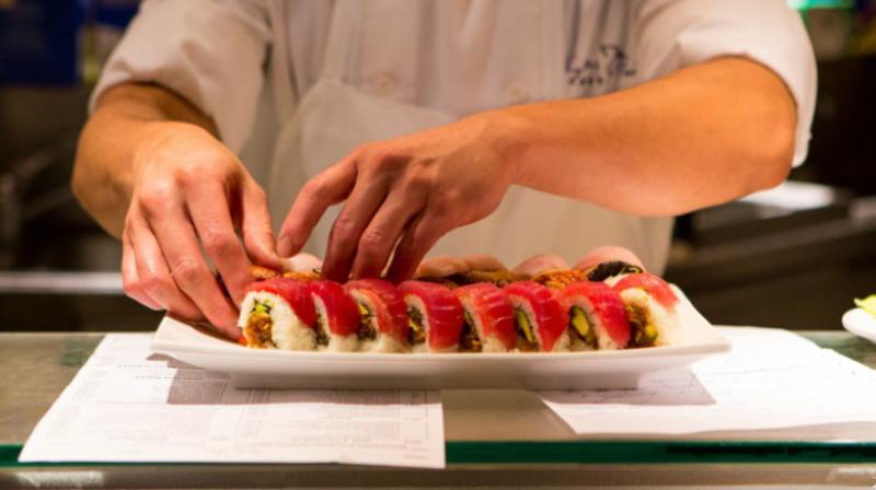 chef making sushi