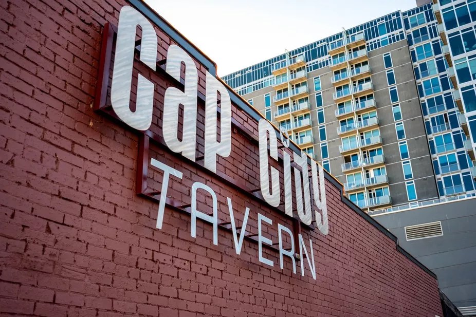 wall of bar with building behind.
