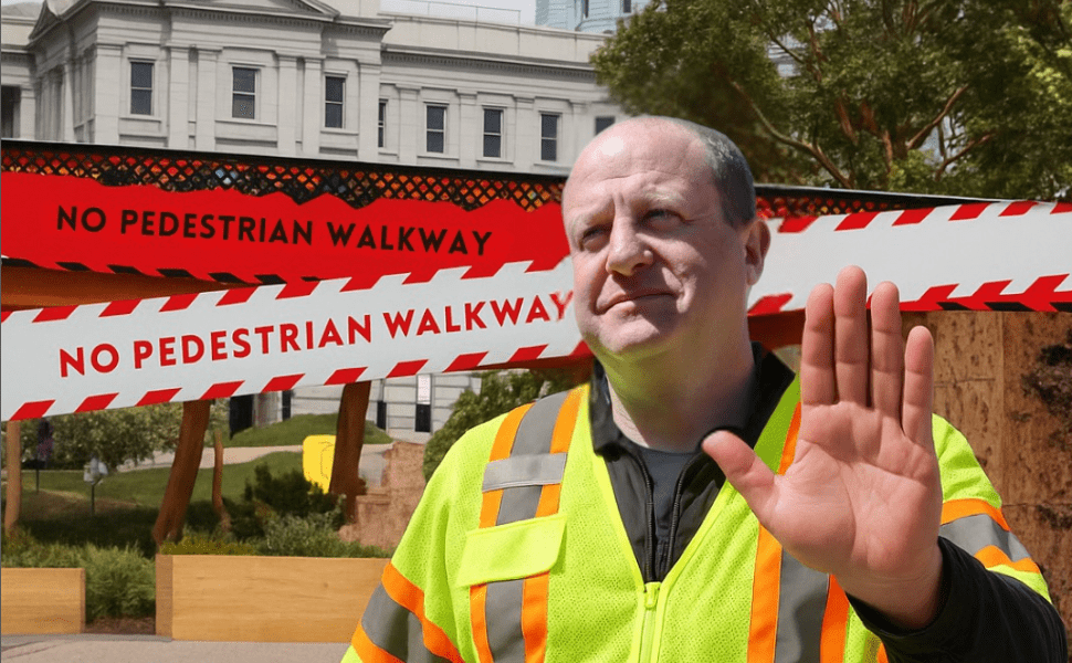 man in yellow  work vest