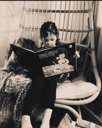 A girl reads a book